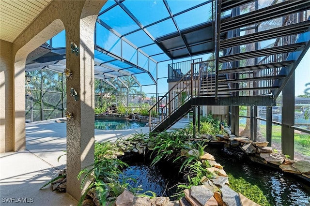 view of patio with a garden pond