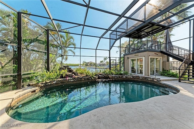 view of pool with a patio and a lanai