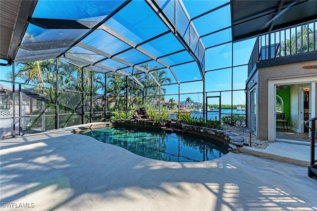 view of pool with a lanai and a patio