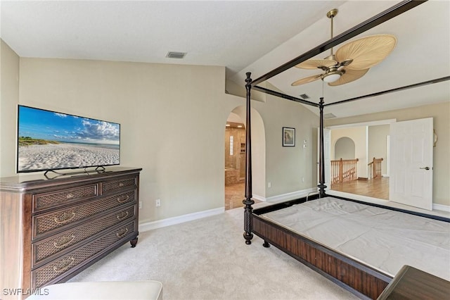 carpeted bedroom featuring ceiling fan and vaulted ceiling