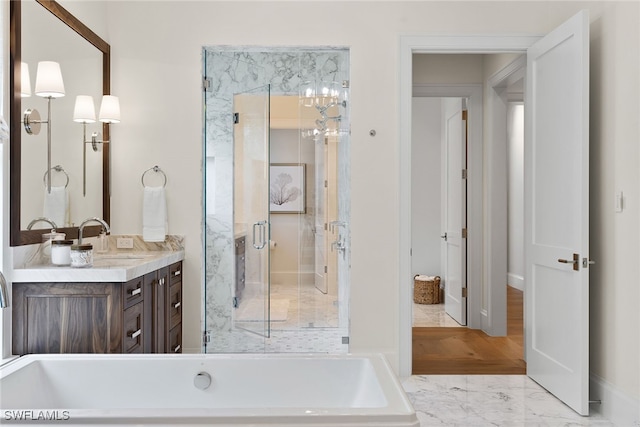 bathroom featuring vanity and separate shower and tub