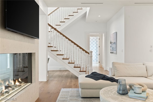 living room featuring a fireplace and hardwood / wood-style floors