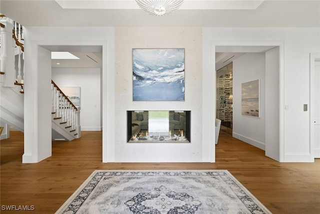 12 Sabre Ln, Naples, FL 34102 - corridor featuring wood finished floors and stairway
