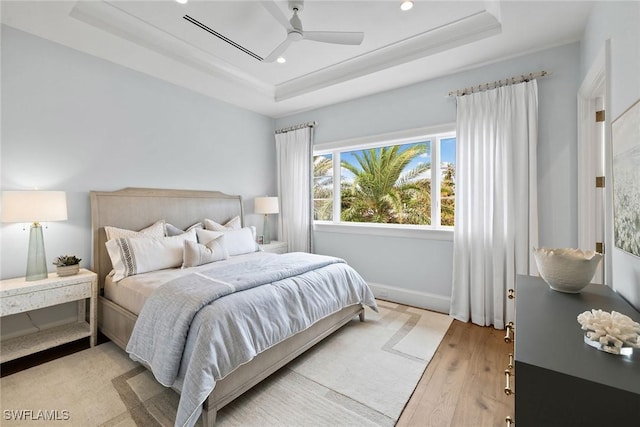 12 Sabre Ln, Naples, FL 34102 - bedroom featuring a raised ceiling, light wood finished floors, recessed lighting, and a ceiling fan