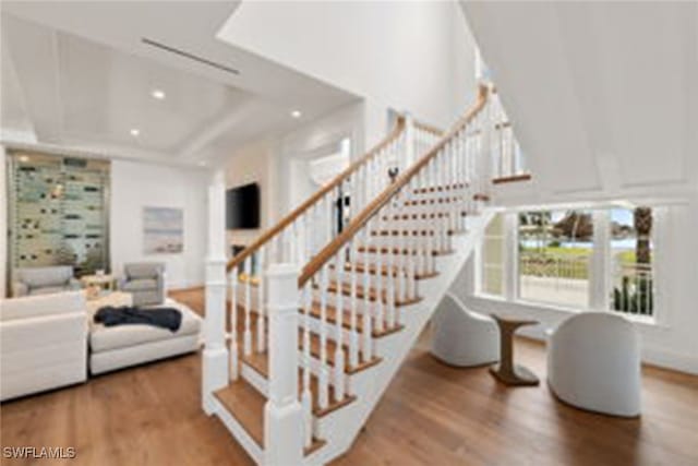 staircase featuring hardwood / wood-style floors