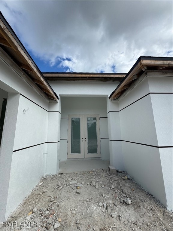 view of side of home featuring french doors