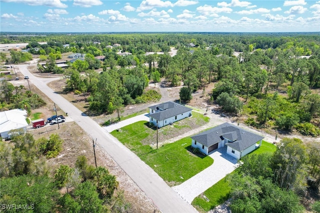 735 Goldrock Rd, Lehigh Acres, FL 33974 - bird's eye view of a heavily wooded area