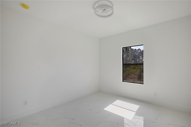 735 Goldrock Rd, Lehigh Acres, FL 33974 - spare room with light marble finish flooring and baseboards