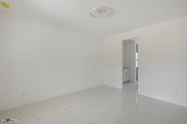 735 Goldrock Rd, Lehigh Acres, FL 33974 - unfurnished room with light marble finish floors and baseboards