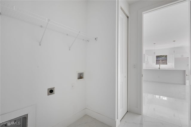 735 Goldrock Rd, Lehigh Acres, FL 33974 - washroom with washer hookup, hookup for an electric dryer, light marble finish floors, and baseboards