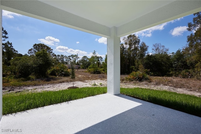 735 Goldrock Rd, Lehigh Acres, FL 33974 - view of patio / terrace featuring view of wooded area