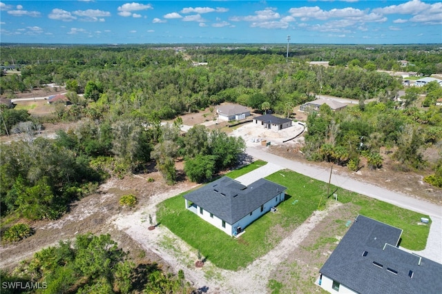 735 Goldrock Rd, Lehigh Acres, FL 33974 - bird's eye view of a heavily wooded area