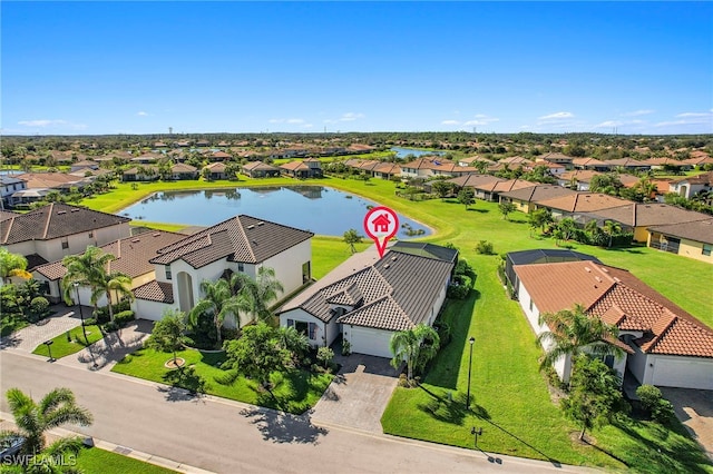 birds eye view of property with a water view