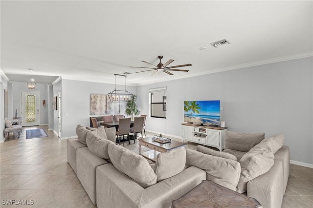 living room with ceiling fan, crown molding, and light tile patterned flooring