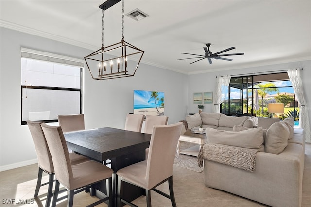 dining room featuring light tile patterned floors, ceiling fan with notable chandelier, and ornamental molding