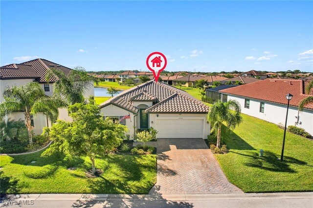 10708 Essex Square Blvd, Fort Myers, FL 33913 - view of front of home featuring a garage, a residential view, a tile roof, and decorative driveway