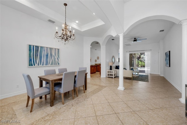 tiled dining area featuring crown molding, decorative columns, a raised ceiling, and ceiling fan