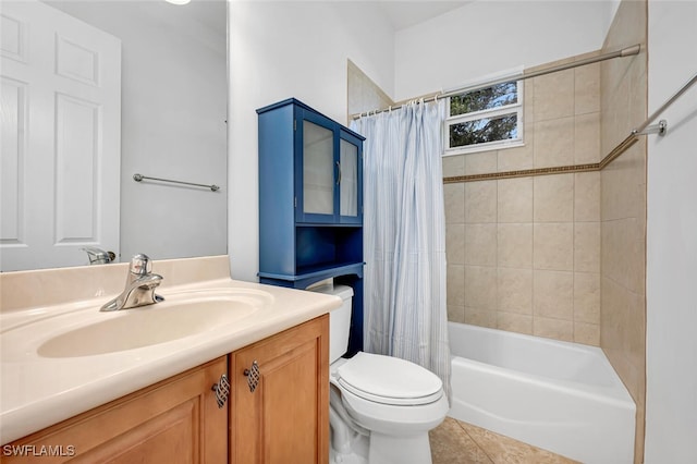 full bathroom featuring tile patterned floors, vanity, toilet, and shower / tub combo