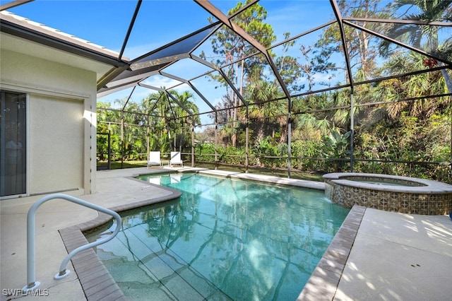 view of pool featuring an in ground hot tub, a lanai, and a patio