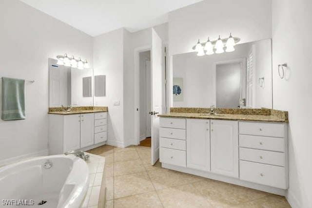 full bath with a bath, tile patterned floors, a sink, and two vanities