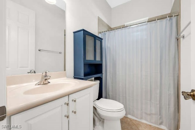 full bathroom with tile patterned flooring, toilet, vanity, and a shower with shower curtain