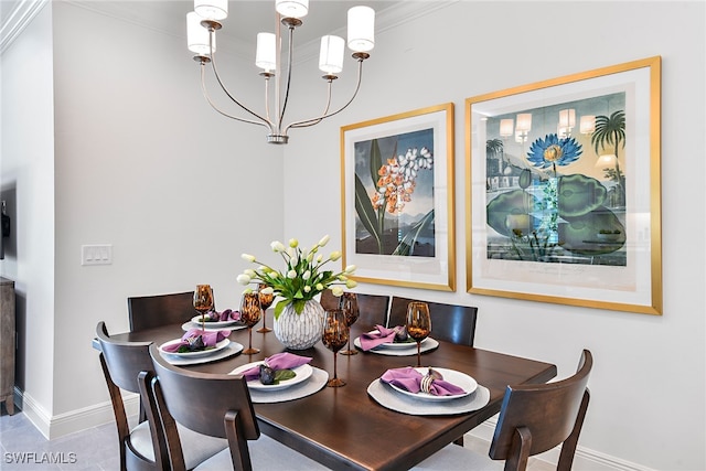 tiled dining area with a chandelier and crown molding