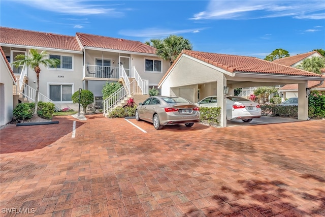 view of front of home featuring a carport