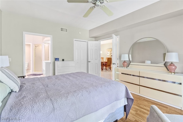 bedroom featuring ceiling fan, a closet, and light wood-type flooring