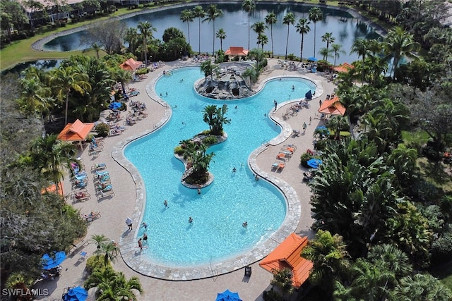 view of swimming pool featuring a patio and a water view