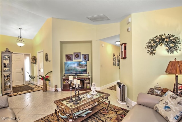 tiled living room featuring high vaulted ceiling