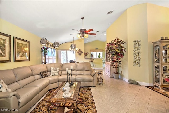 living area featuring ceiling fan, light tile patterned floors, vaulted ceiling, and baseboards