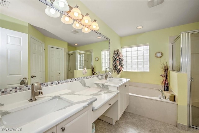 full bathroom with a stall shower, a bath, vanity, tile patterned flooring, and recessed lighting