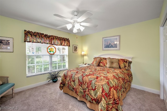 bedroom with ceiling fan, a closet, and carpet