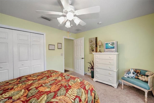 bedroom with light carpet, a closet, ceiling fan, and baseboards