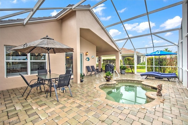 view of swimming pool featuring a lanai, a patio, and a hot tub