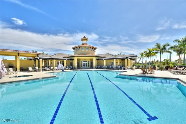 view of swimming pool featuring a patio area