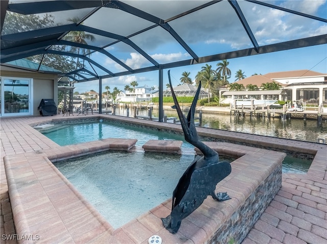 view of pool featuring glass enclosure, a boat dock, area for grilling, an in ground hot tub, and a water view