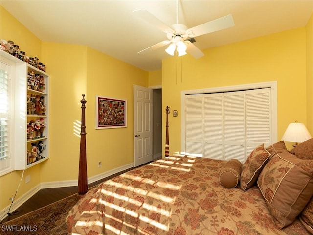 bedroom featuring ceiling fan, a closet, and hardwood / wood-style flooring