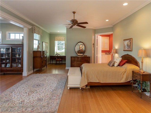 bedroom with hardwood / wood-style flooring, ceiling fan, and ornamental molding