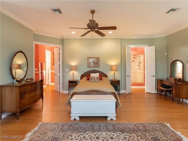 bedroom featuring ceiling fan, ornamental molding, connected bathroom, and light hardwood / wood-style flooring