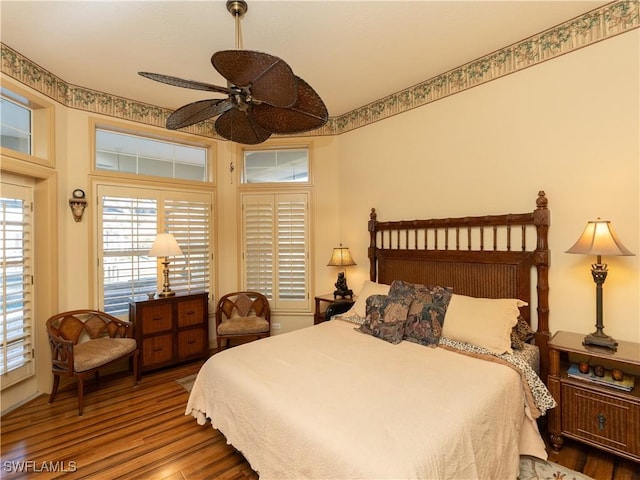 bedroom featuring ceiling fan and wood-type flooring