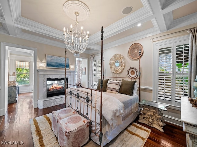 bedroom featuring coffered ceiling, dark hardwood / wood-style floors, a high end fireplace, and multiple windows