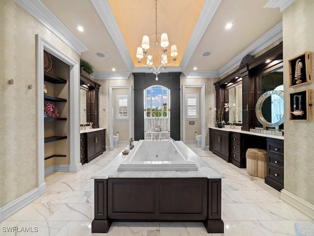 bathroom featuring vanity, crown molding, a chandelier, toilet, and a tub