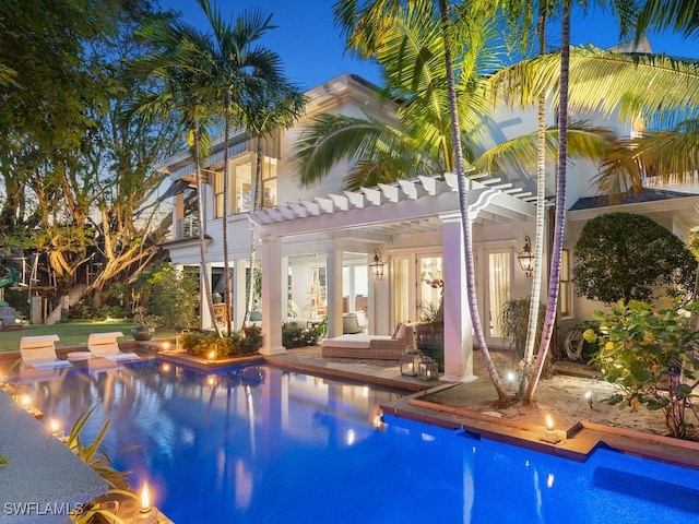 view of swimming pool featuring a pergola and a patio area