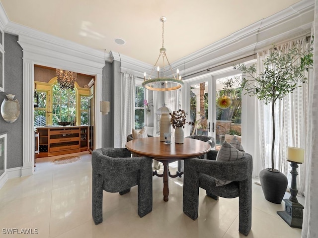 tiled dining area with a notable chandelier, a healthy amount of sunlight, crown molding, and french doors