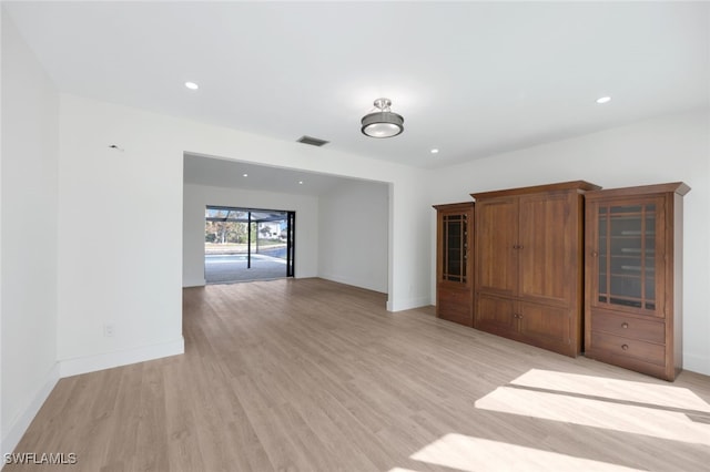 spare room with light hardwood / wood-style floors