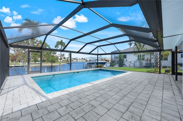 view of swimming pool featuring a water view, glass enclosure, and a patio