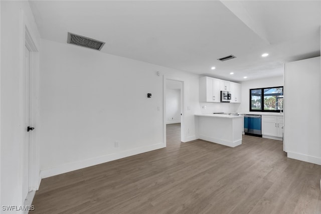 unfurnished living room featuring hardwood / wood-style floors