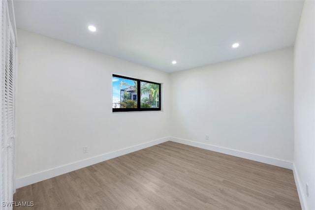 unfurnished room with light wood-type flooring