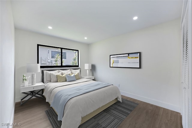 bedroom with wood-type flooring